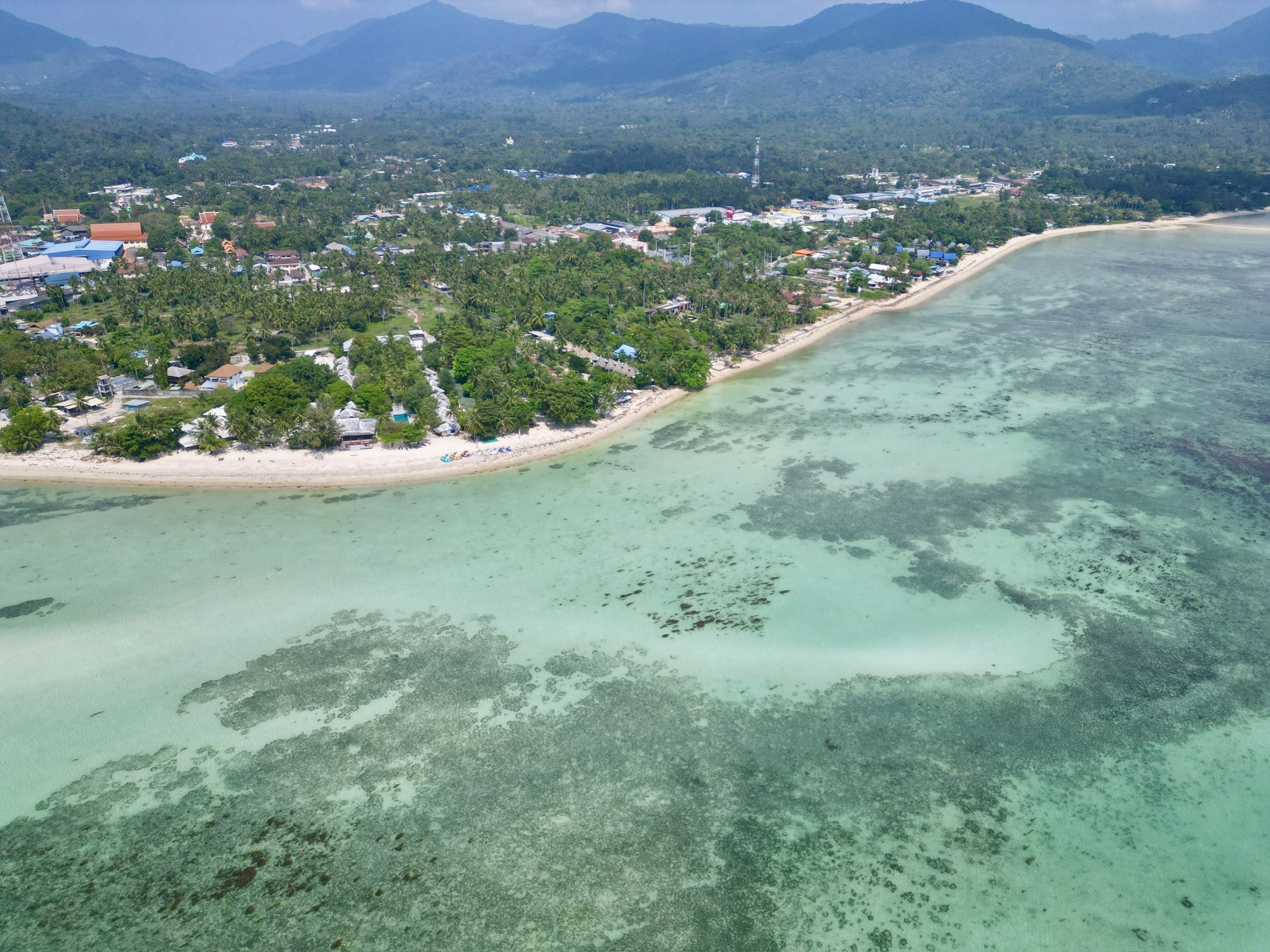Windsurfing spot at Thong Sala Beach Koh Phangan — flat water lagoon at sunset