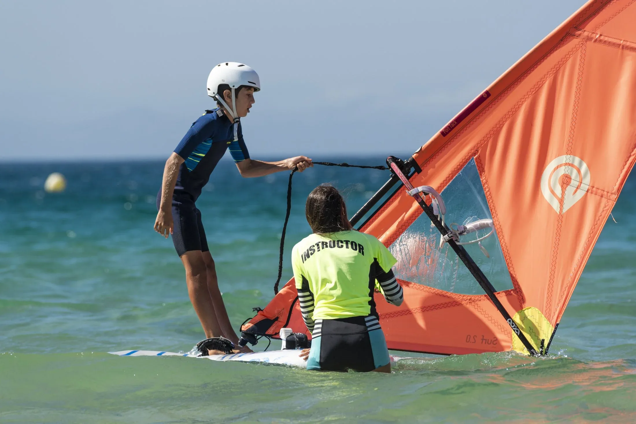 Windsurfing discovery lesson Koh Phangan — beginner sail rigging on flat water lagoon