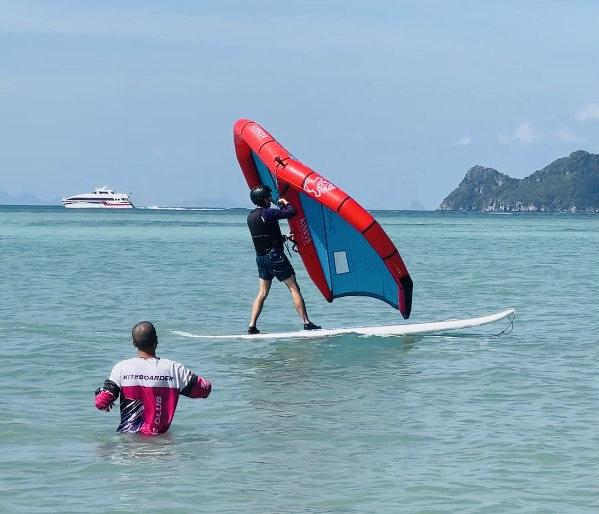 Learn wing foil at Koh Phangan — IWO certified instructor coaching on flat water lagoon